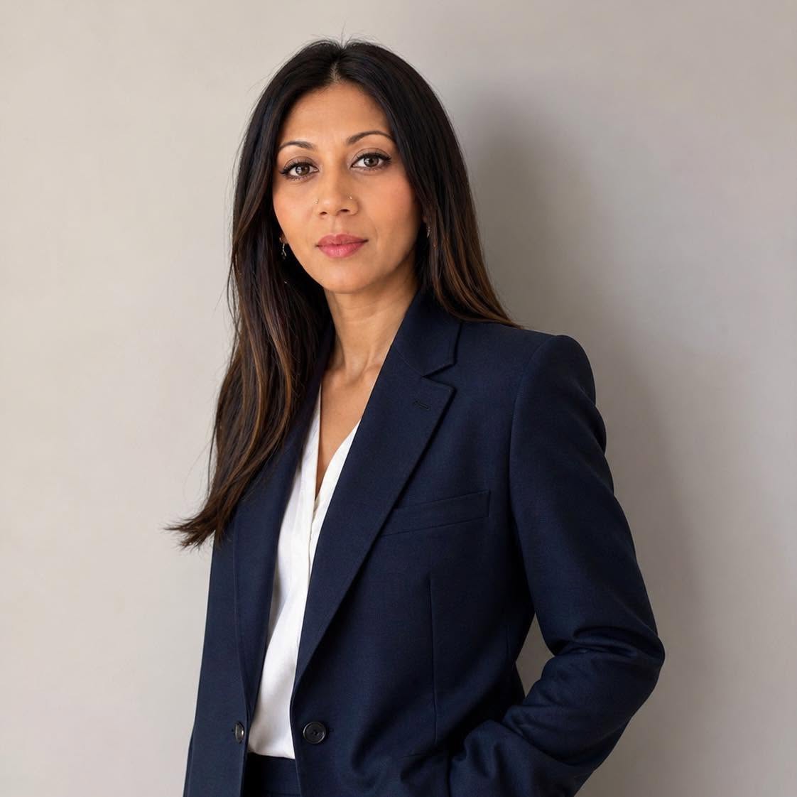 Dr Larisha Pather Aesthetic Physician in clinical suit